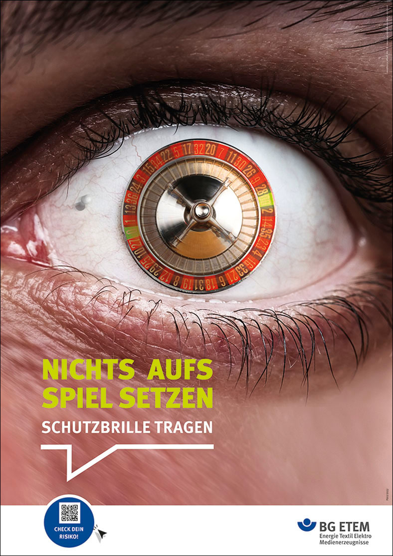 Plakatkampagne BG ETEM 2022: Motiv Schutzbrille tragen. Auge mit  Roulettespiel als Pupille.